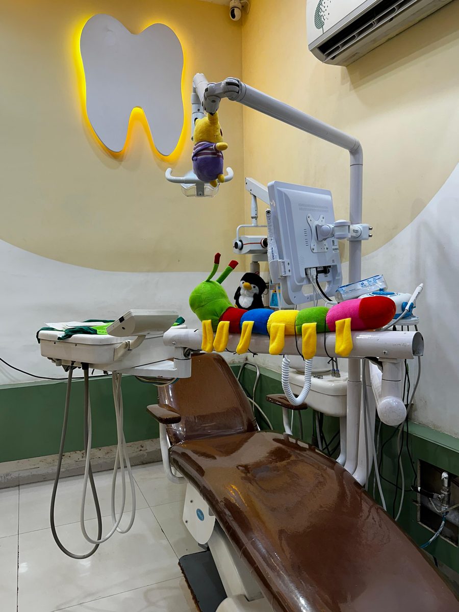 Pediatric dental chair with a colourful, child-friendly setup at Happy Tooth, Mohamadwadi