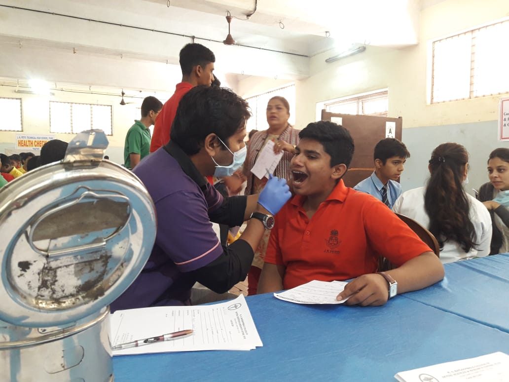Community dental awareness camp organised by Happy Tooth Dental Care in Pune