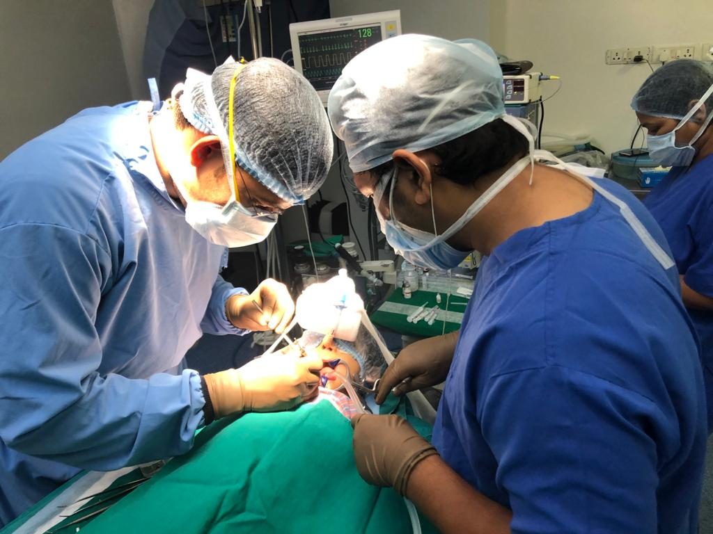 Oral surgery being carried out by the surgical team at Happy Tooth Dental Care, Pune